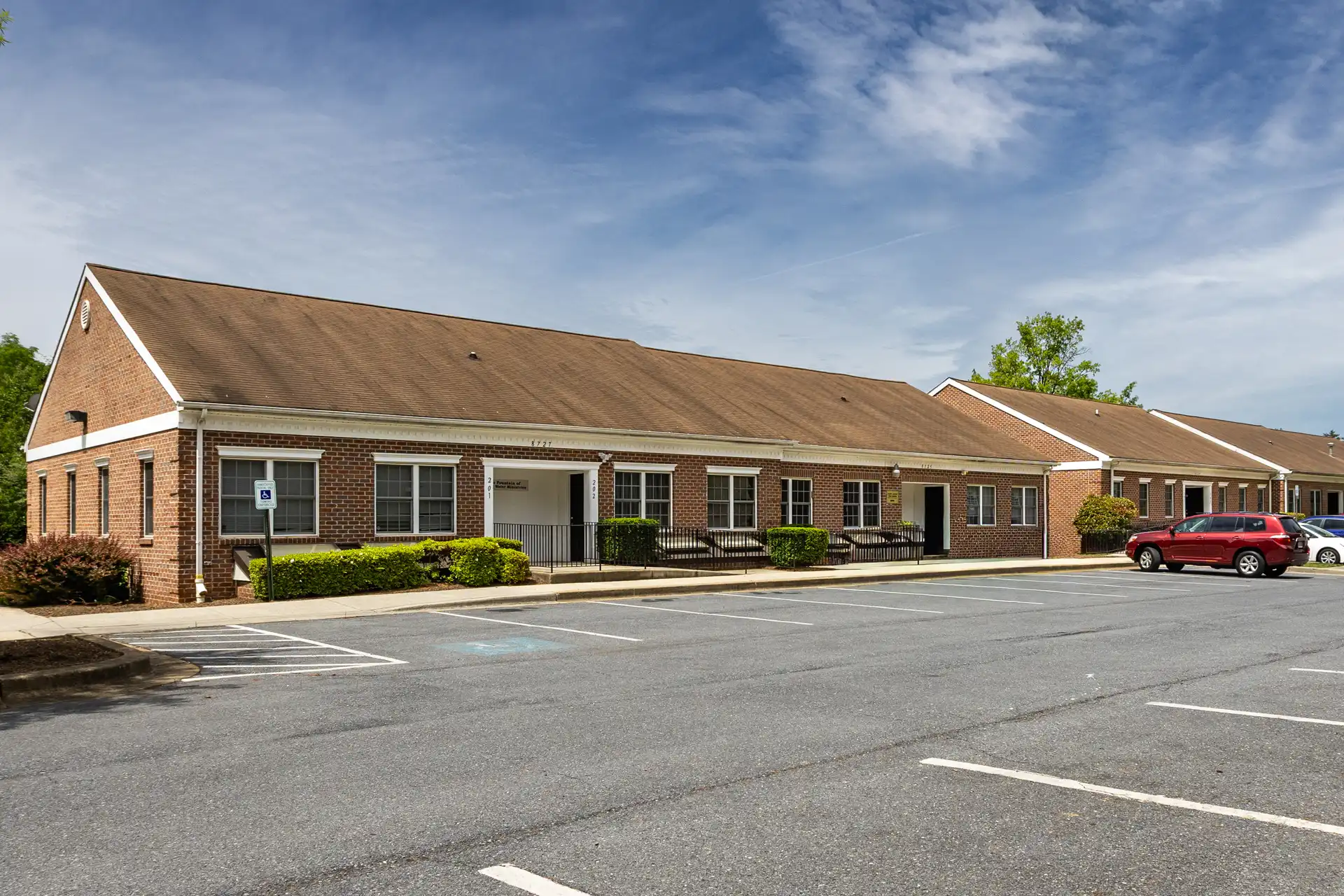 An image of a brick building exterior where there are move in ready office suites for lease in Maryland.