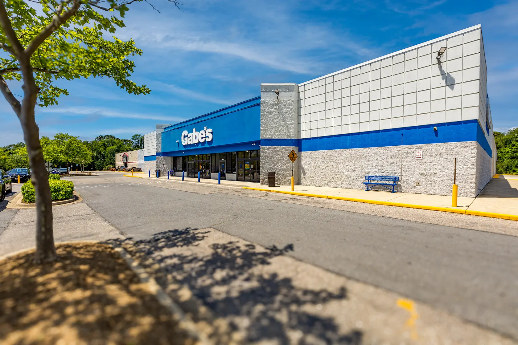 An exterior image of a Gabe's store and parking lot at Park 97 Shopping Center, where there are Maryland retail storefronts for lease.