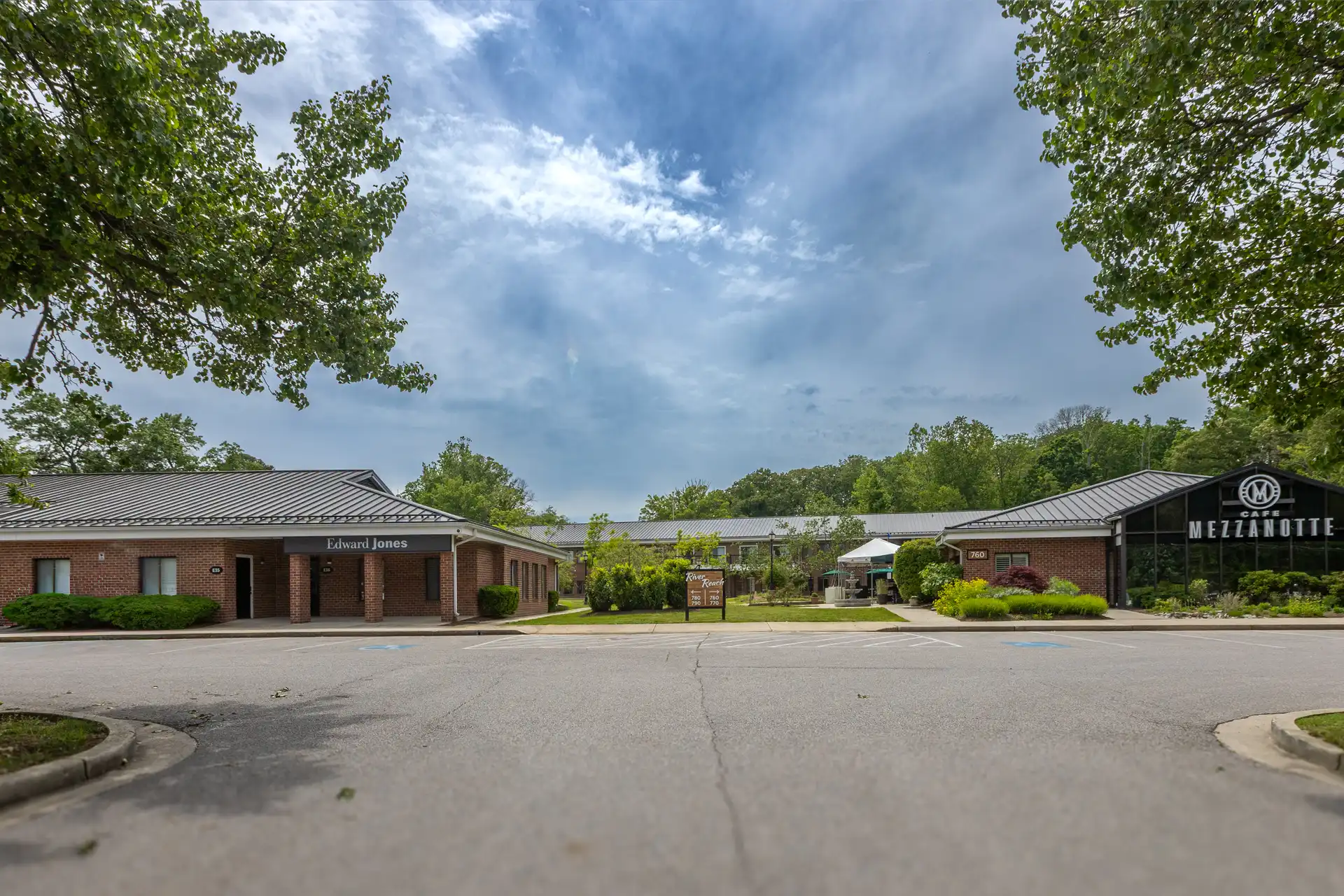 Trees and landscaping outside brick buildings where there are contemporary office spaces for lease in Severna Park MD.