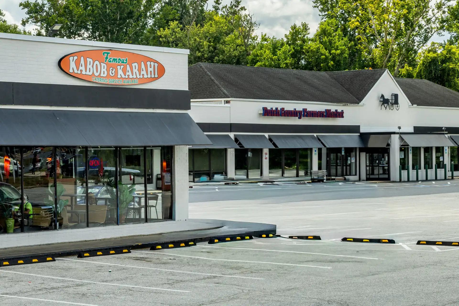 The outside of a Pakistani restaurant at Steward Village Shopping Center, a Laurel MD shopping center with retail spaces for rent.